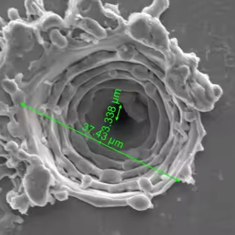 Precision laser microvias